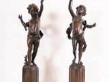 pair of antique bronze figurines of cherensils on marble bases
