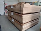 a large stack of boxes sitting on the floor in a warehouse