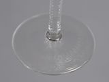 a wine glass that is sitting on top of a table