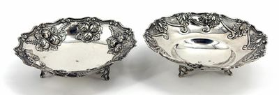pair of antique silver plated dishes on stands on a white background