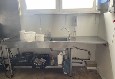 a kitchen with a sink and a stove in it