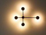 a light that is on in a room with a ceiling light