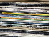 a lot of records stacked on top of each other