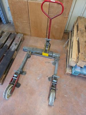 a red handle on a dolly in a room