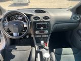 a dashboard of a car with a steering wheel and dashboard controls