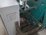 a picture of a machine that is working on a piece of metal