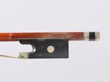 the bow is made of wood and has a metal tip