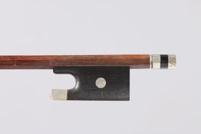a close up of a violin bow on a white background