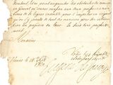 une vieille lettre écrite à l'encre noire sur un morceau de papier