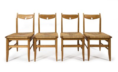 four wooden chairs are lined up against a white background
