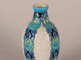 a blue and white vase sitting on a table
