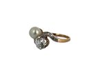 an image of a diamond and pearl ring on a white background
