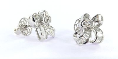 pair of diamond earrings on a white background