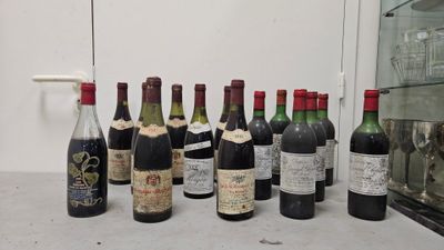 several bottles of wine are lined up on a counter