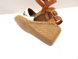pair of women ' s espadrills on a white surface with a white background