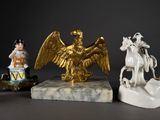 three figurines of a man on a horse and a man on a horse