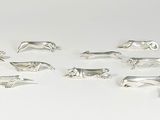 silver plated animal figurines on a white background