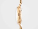 a close up of a gold watch with a chain around it