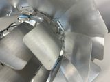 a close up view of a metal fan on a table