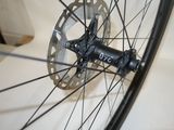 a close up of a bicycle wheel with a disc