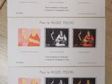 four postcards with different images of people on them on a table