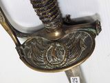 a close up of a sword with a metal handle