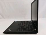 the back of a laptop computer sitting on top of a white table