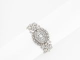 a close up of a diamond ring on a napkin