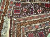 a rug on the floor with a cat laying on top of it