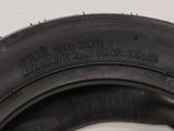 an image of a close up of a tire on a white surface