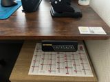 a desk with a keyboard and a mouse on it