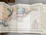an open book with a map of the united states on it