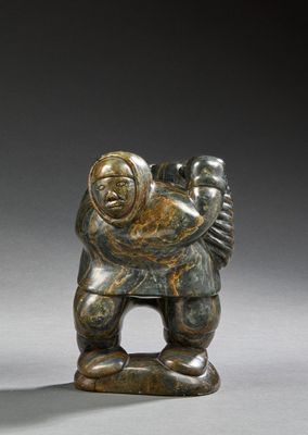 a statue of a man carrying a child on his back