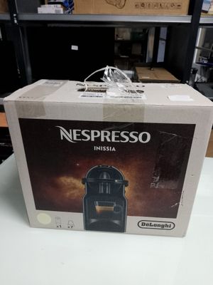 a box of nespresso coffee machine on a table