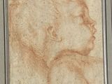 drawing of a man ' s head in a frame on a wall