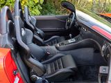 an image of a red sports car with its doors open