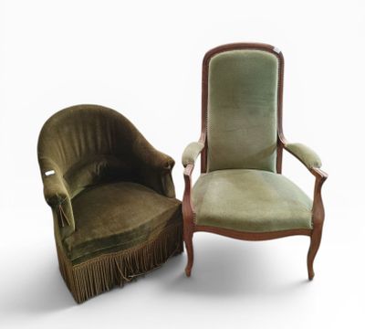 pair of green velvet armchairs with fringed arms