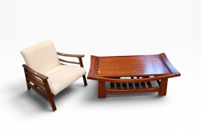 two chairs and a coffee table on a white background