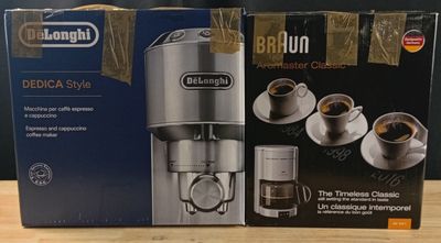 two boxes of delonghi coffee machines sitting on a wooden table