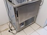an image of a kitchen with a sink and a freezer
