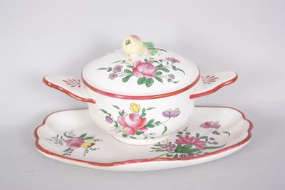 a white bowl and saucer with a bird on top of it