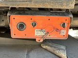a red and black box on the back of a truck