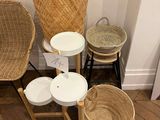 several wicker chairs and stools in a corner of a room