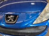 a blue car that is parked in a garage