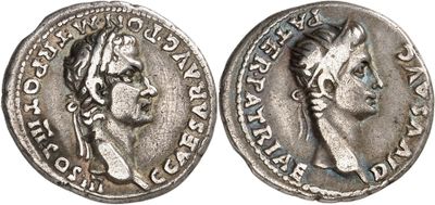 a silver coin with an image of a woman on it