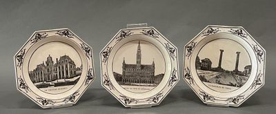 three plates with a picture of a building and a clock on them