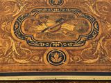 a wooden table with a painting on the top of it