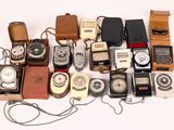 many different types of old fashioned phones on a white surface