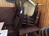 many chairs stacked on top of each other in a room