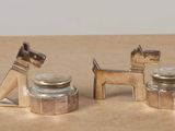 two salt and pepper shakers with a dog on them
